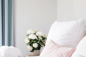 Pretty Bed with Flowers and a Breakfast Tray