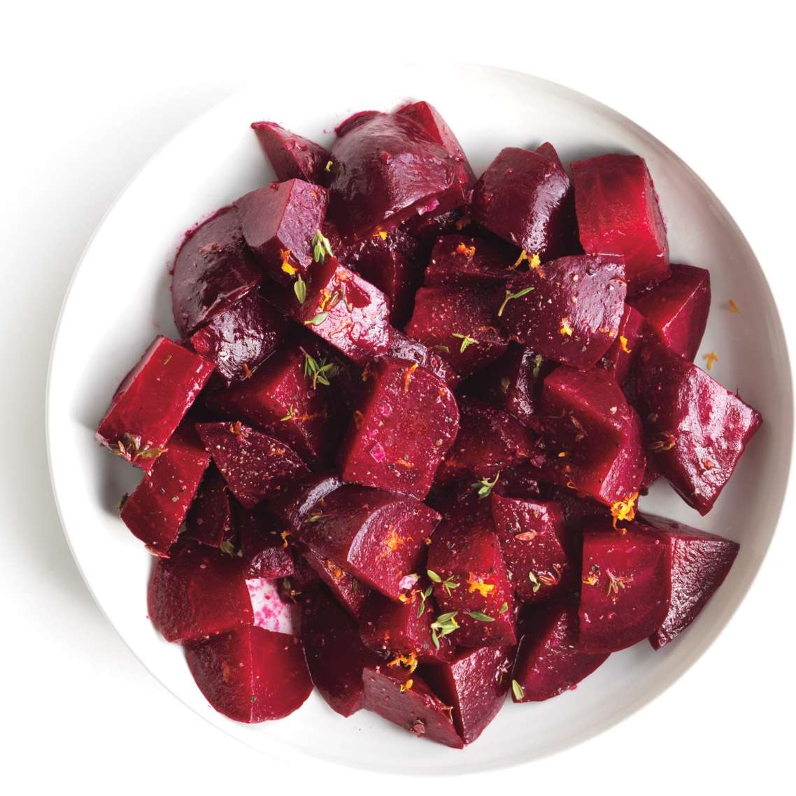 roasted beets with orange in a white bowl