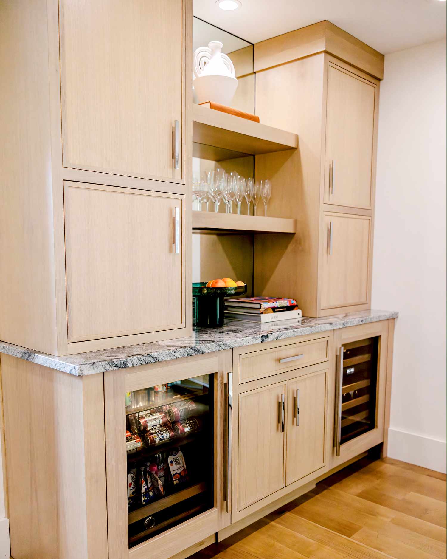 kitchen cabinets with beverage fridges and open shelving