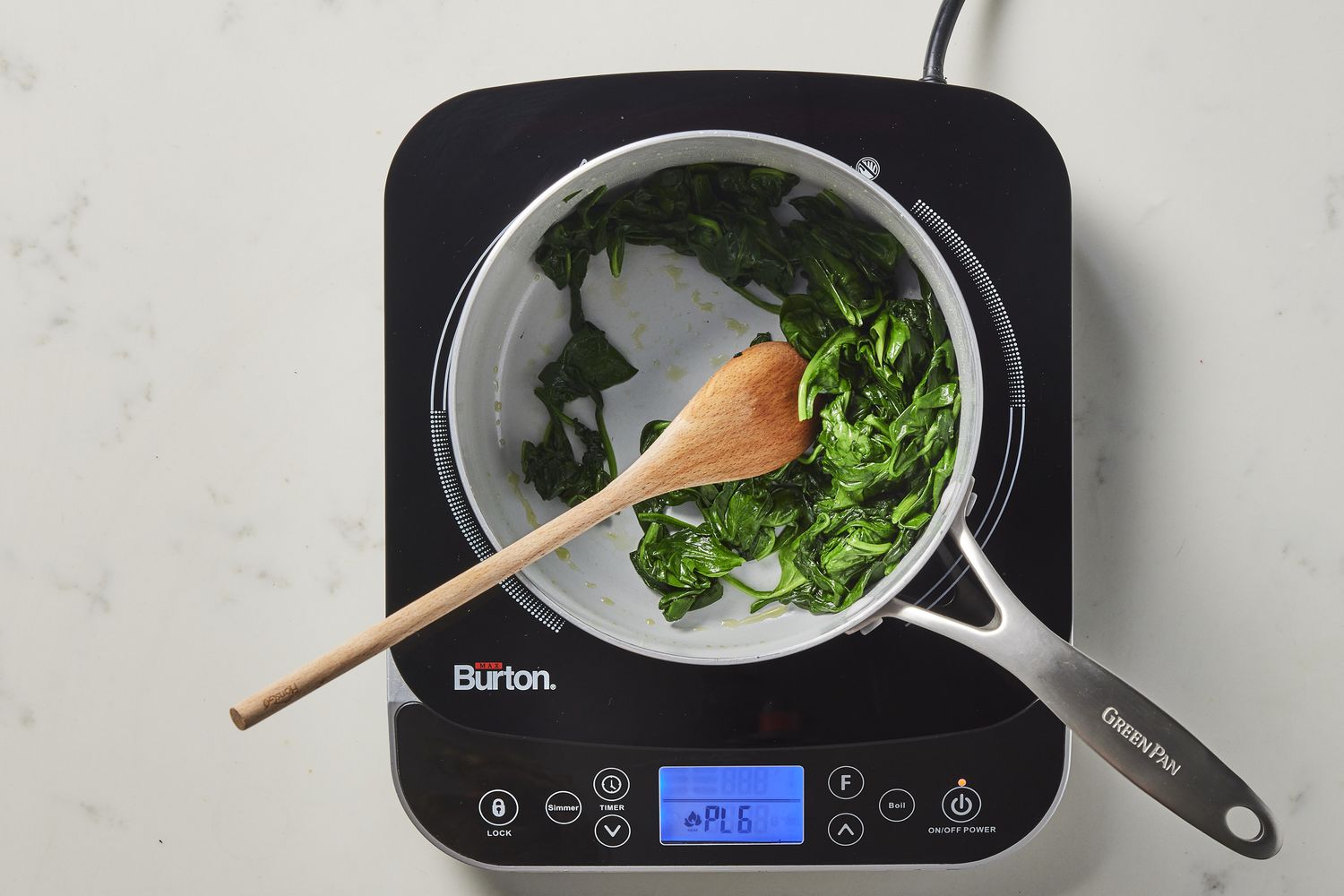 Spinach cooking in skillet