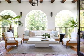 Veranda with archway door, couches, and chairs