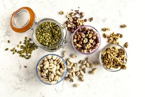 nuts and seeds in glass jars from above