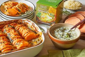 Baked sweet potato slices in a ceramic dish spinach artichoke dip in a bowl and a box of Trader Joes creamy spinach artichoke dip