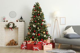 Beautiful interior decorated for Christmas or New Year. Christmas tree and gifts. Place for text