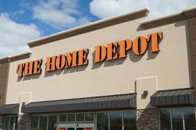 The exterior of a Home Depot store with its sign prominently displayed on the building