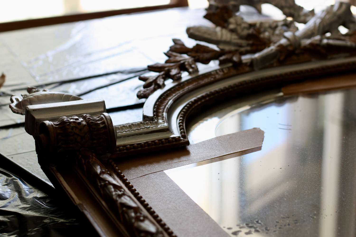 renovation of an old antique mirror with a view of a deckchair on the terrace. leisure at home.