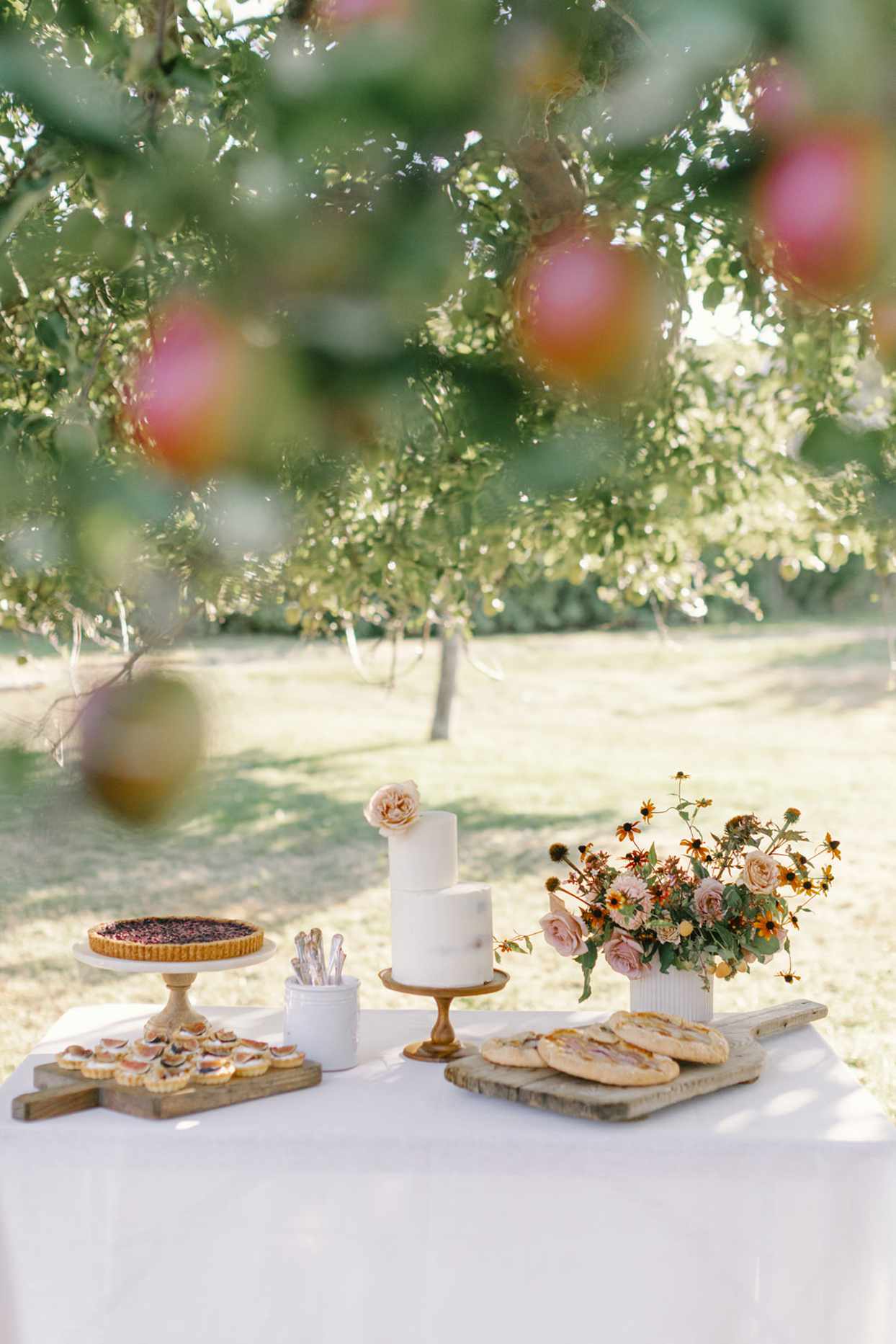 dessert table with cake and small bites