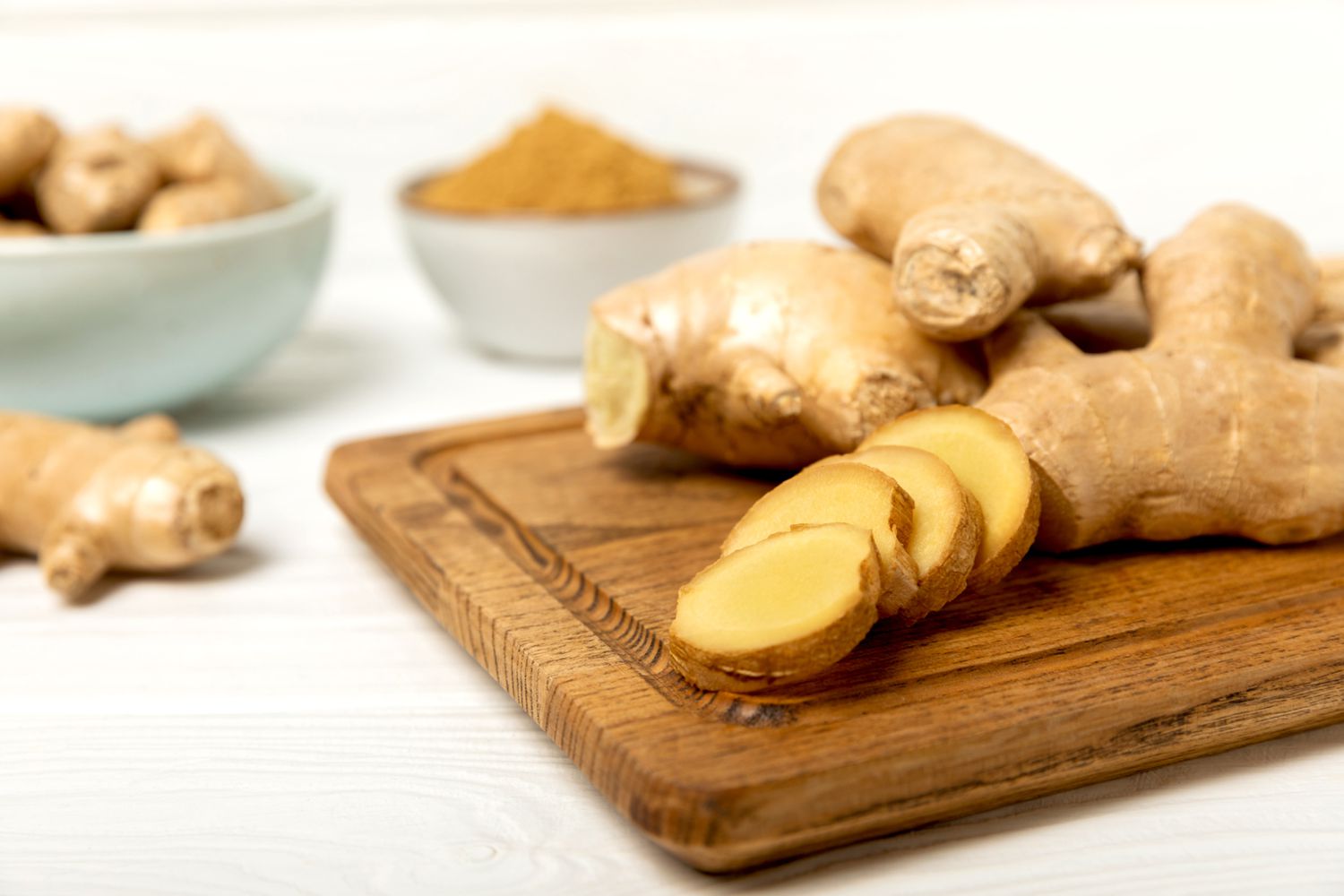 Fresh ginger on wooden cutting board