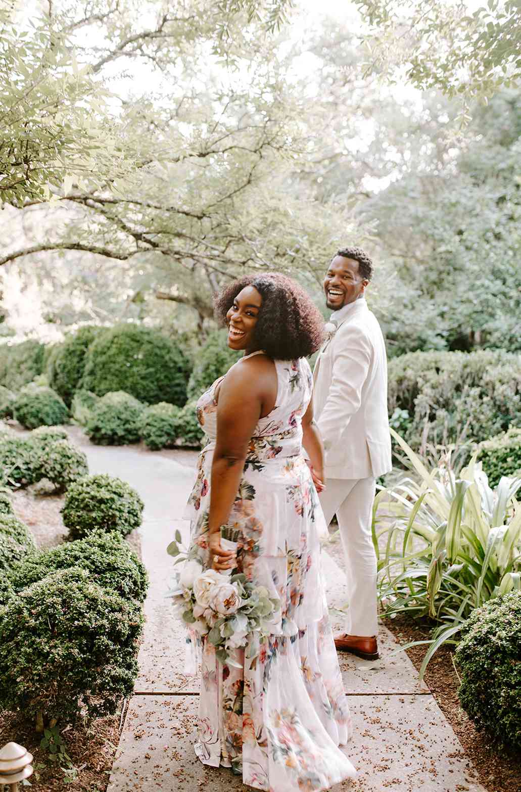 chelsea and jordaan wedding couple smiling and holding hands