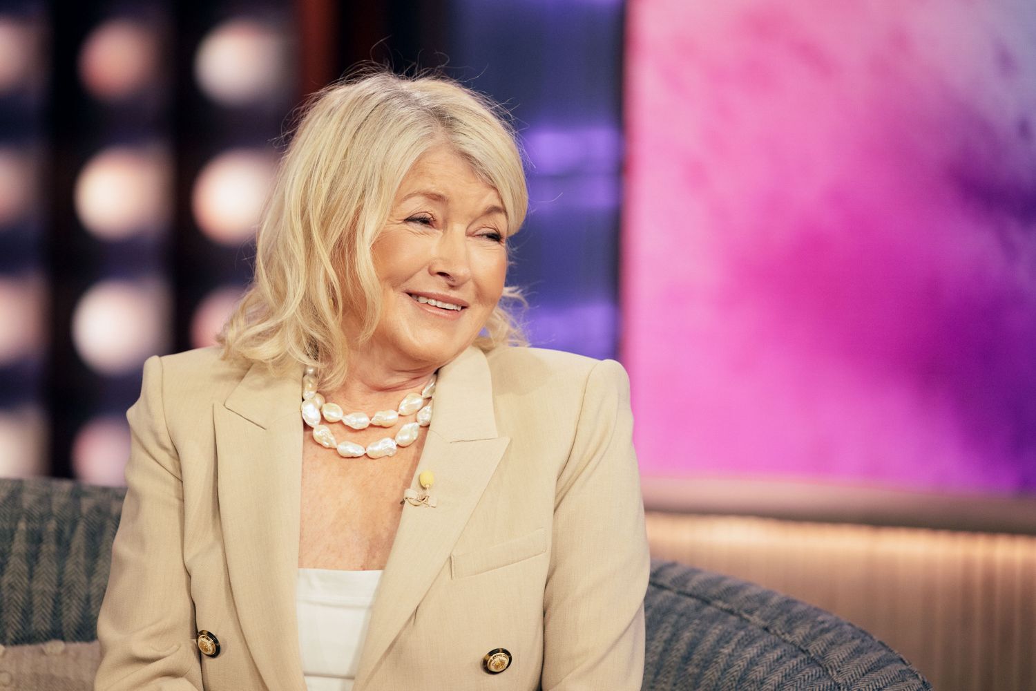 decorvow seated and smiling during an interview