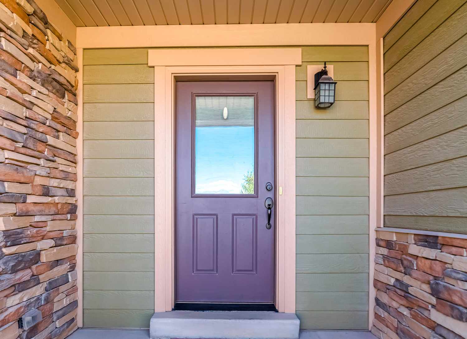 soft purple door on green house