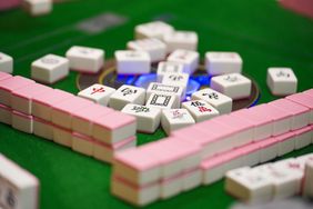 A selective focus shot of mahjong tiles on a table