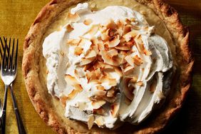 double-coconut cream pie on gold table cloth
