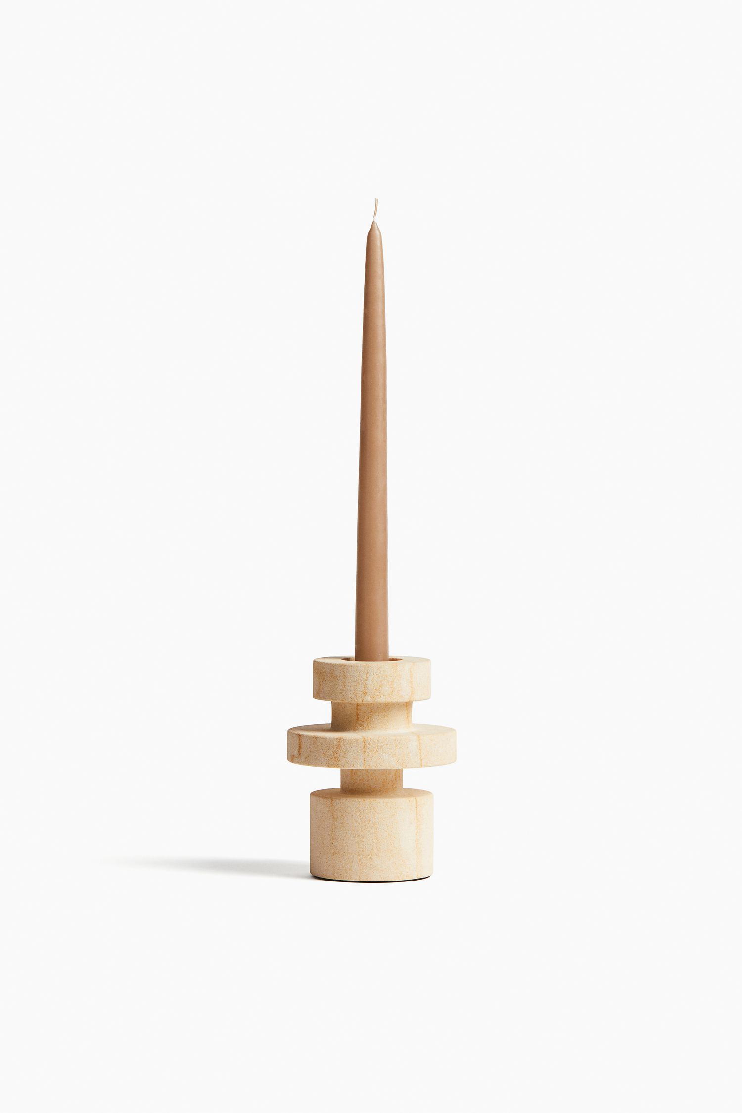 a small sandstone candle holder
