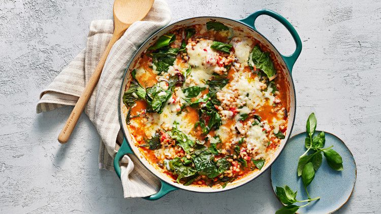 cheesy stove-top barley and swiss chard served with fresh basil