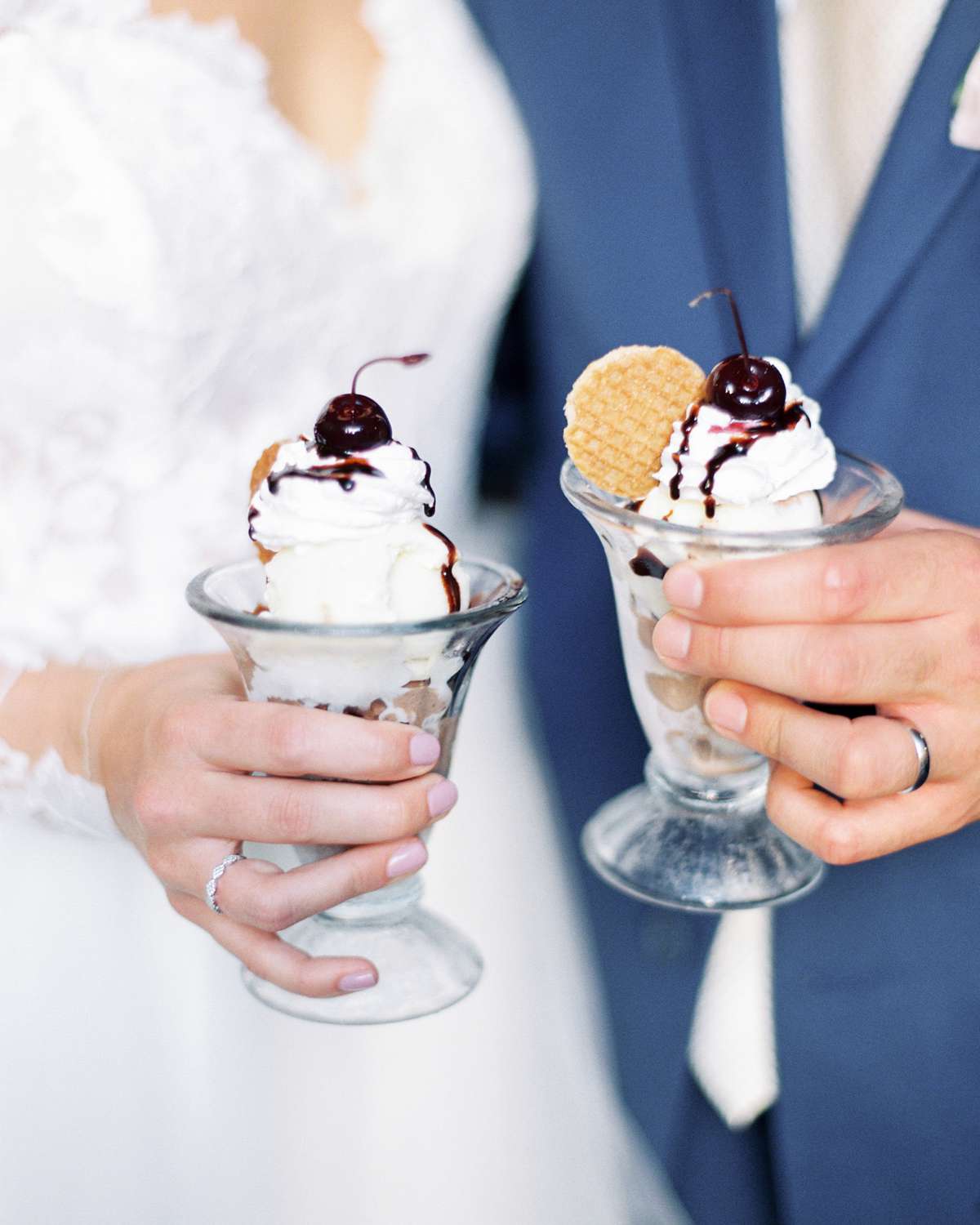 bride and groom each holding an ice cream sundae