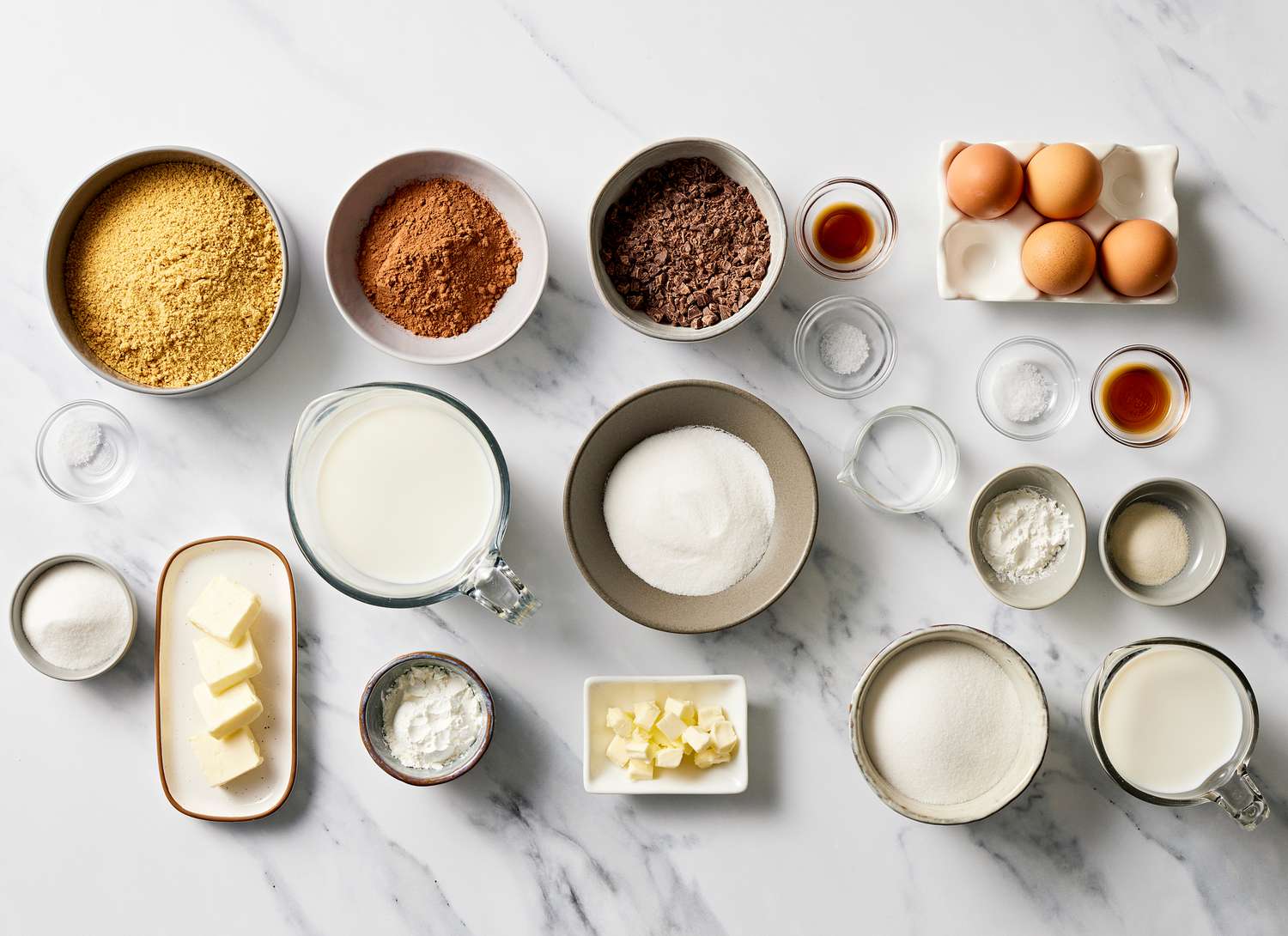 ingredients for making a pie on a marble surface