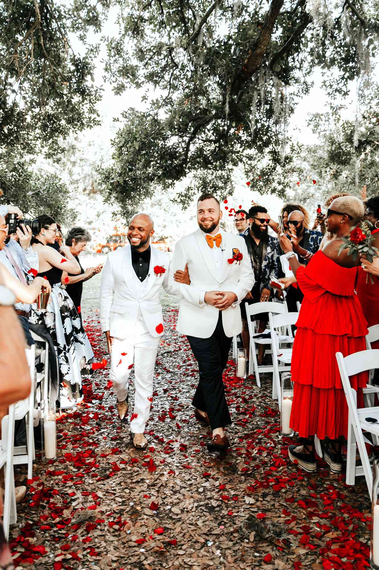 joe tim new orleans wedding grooms recessional petals