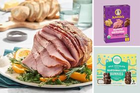 A platter with sliced ham garnished with herbs and oranges next to packaging for Annies Bunny Grahams and Whole Foods Milk Chocolate Bunnies