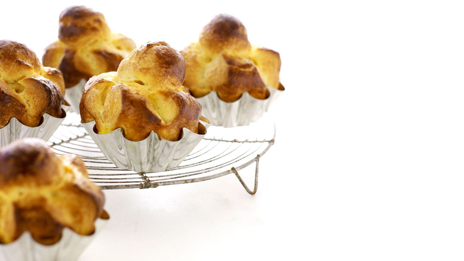 mini brioche a la tete on a cooling rack