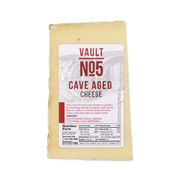 Vacuumpacked block of Vault No 5 Cave Aged Cheese with label details visible