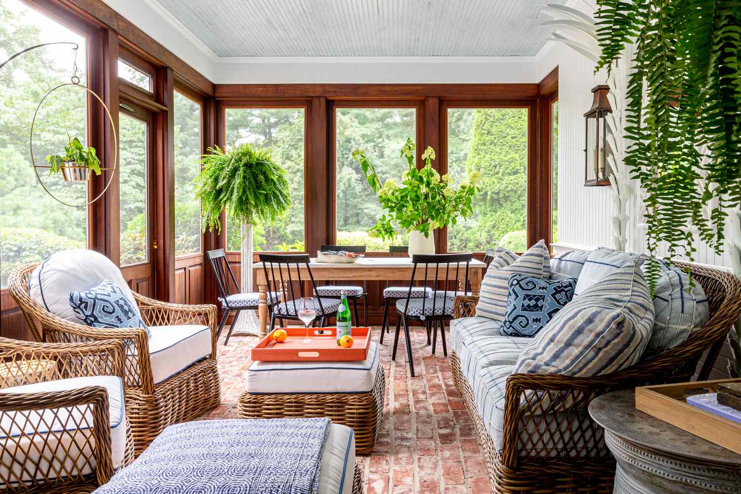 white and wood porch with wicker furniture