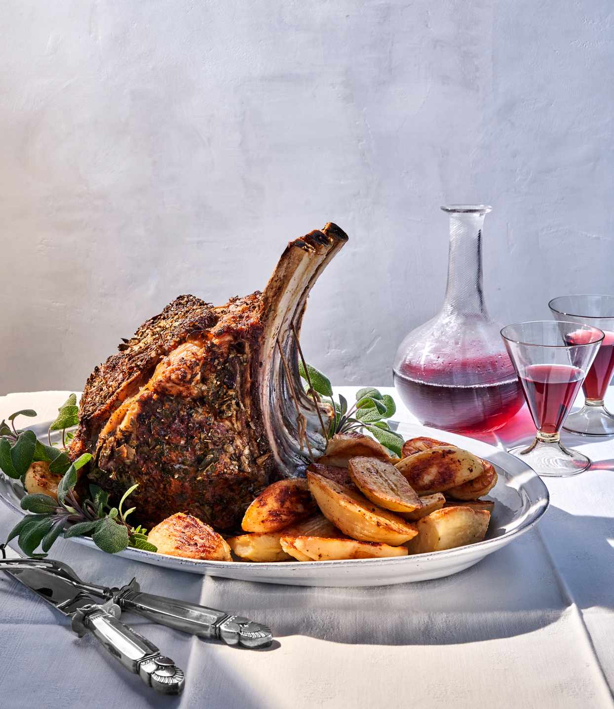 Prime Rib and Oven-Roasted Potatoes with Bay Leaves and Sage