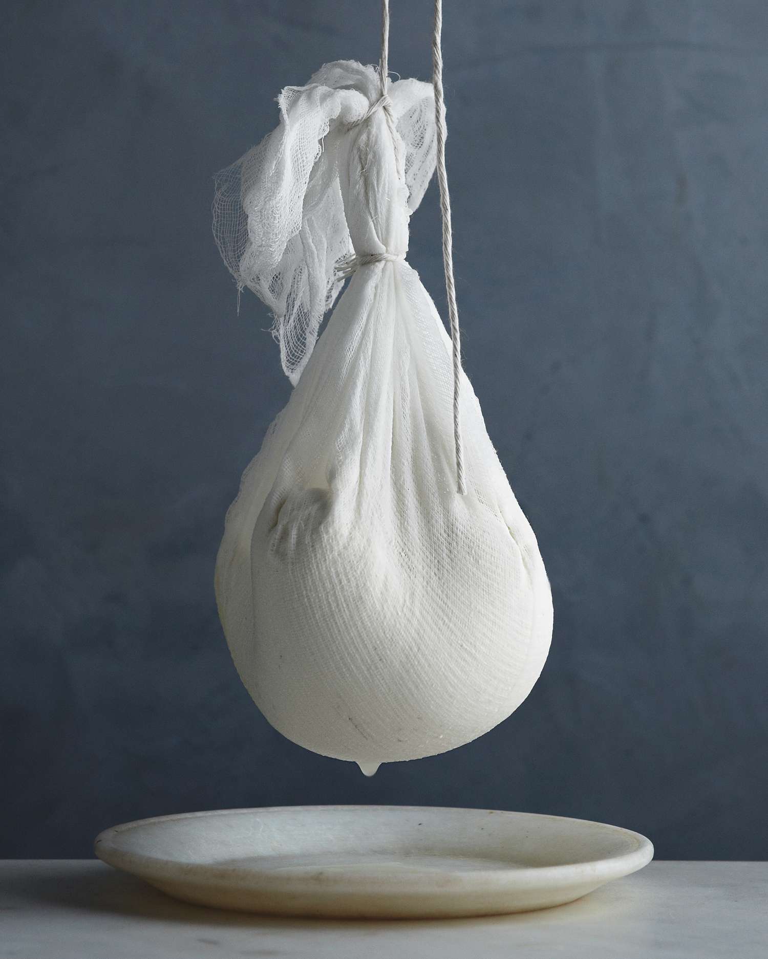 homemade ricotta being drained