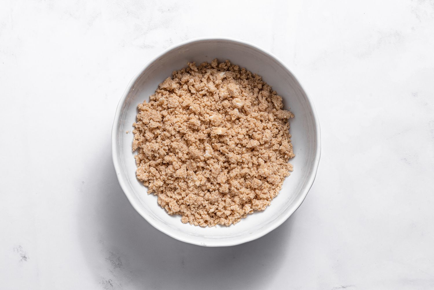 crumb mixture in bowl for apple pie cake