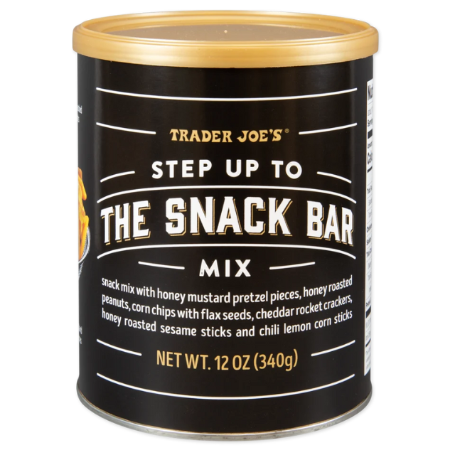 Trader Joes snack mix container labeled Step Up to the Snack Bar Mix featuring various snack items description on the front