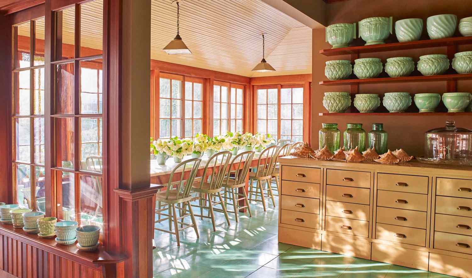 open porch dining area with teal-blue flooring