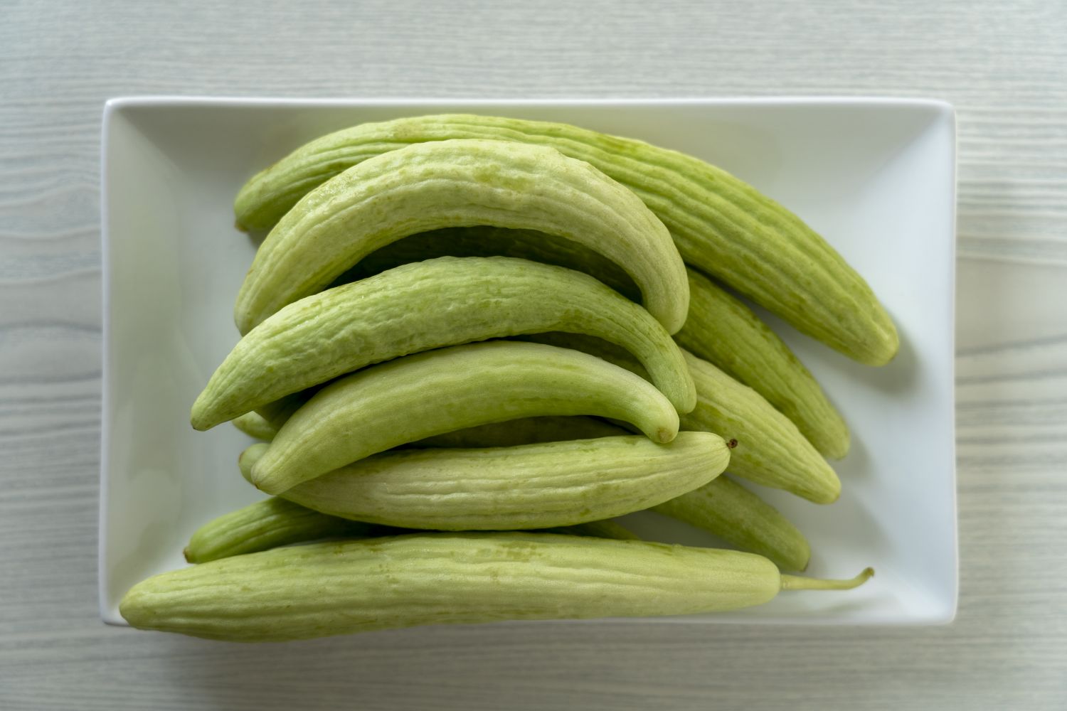 armenian cucumbers in white dish
