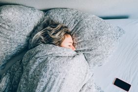 woman sleeping with phone