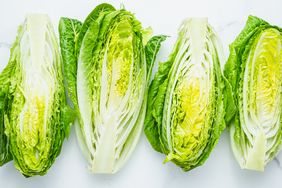 Fresh romaine lettuce on a white table.