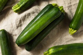 green zucchini on natural linen cloth