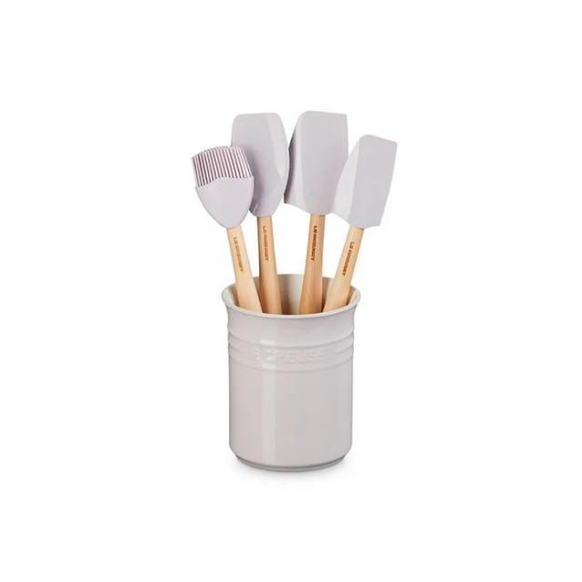 A set of kitchen silicone spatulas in a ceramic holder
