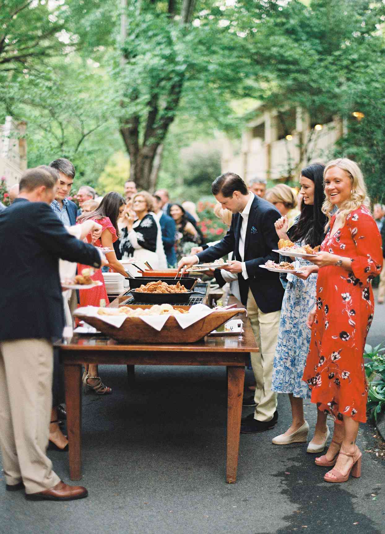 guests walking through buffet at welcome party