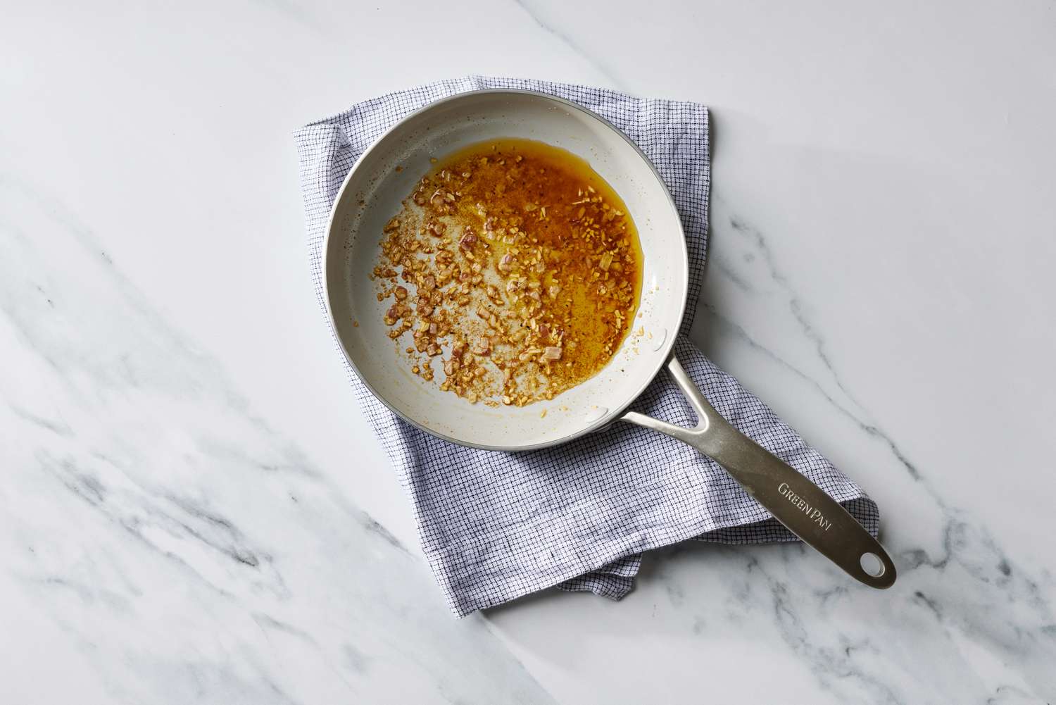 Spices, oil, garlic in pan