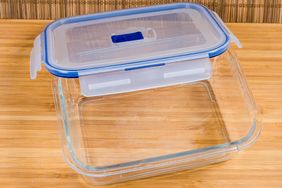 A glass food storage container with a plastic lid