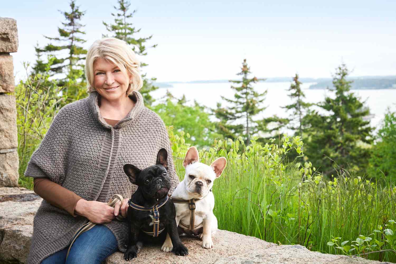 martha posing with her french bulldogs outside