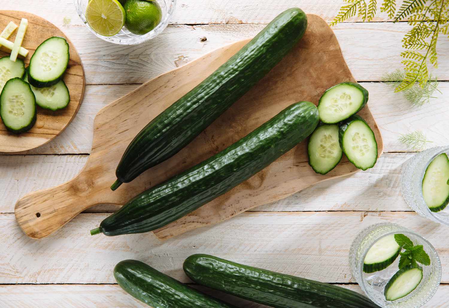 Sliced cucumbers on wood cutting board