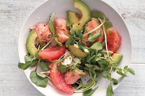 grapefruit and salmon salad on white background