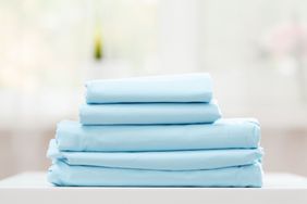 Folded blue bed sheets