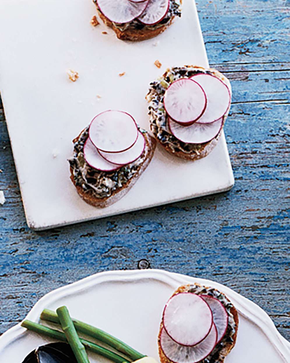 radish canapes with black olive butter