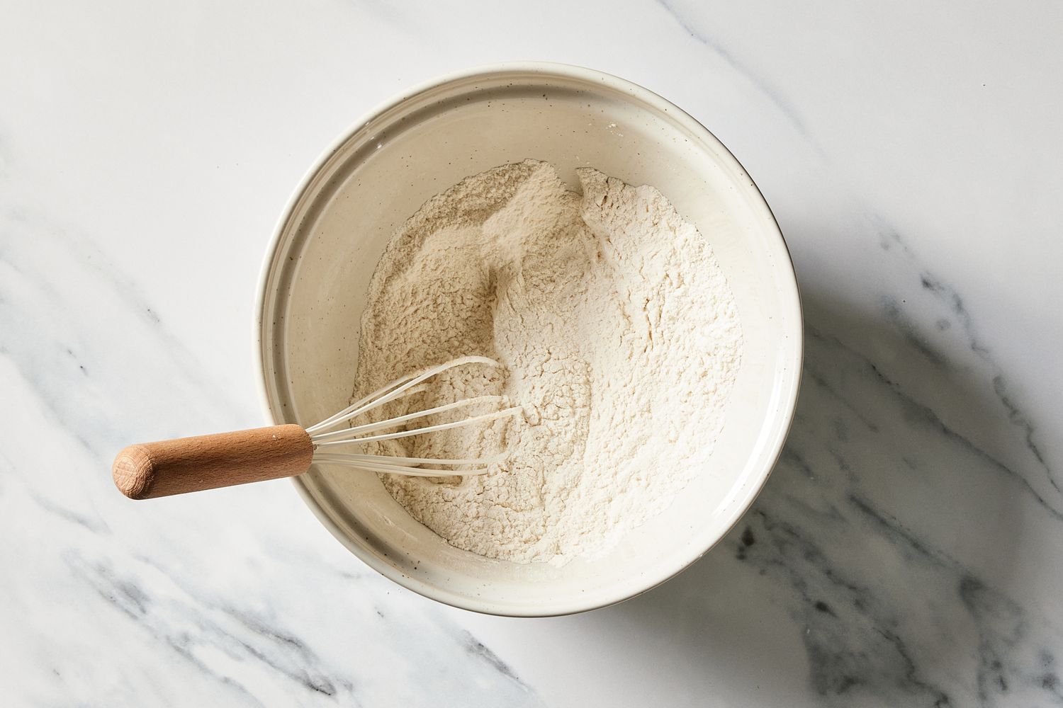 Dry Ingredients in a bowl with whisk for Sour Cherry Crumb Cake