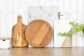 Various cutting boards arranged on a kitchen counter