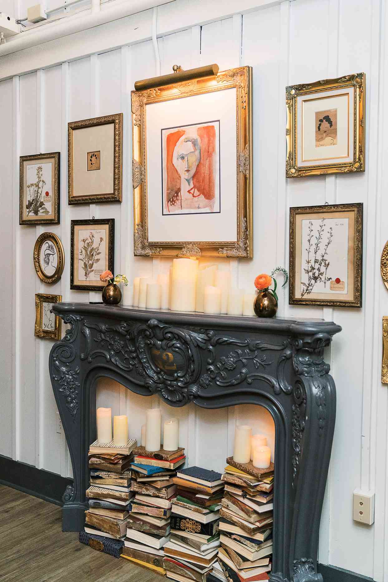 faux fireplace filled with book stacks