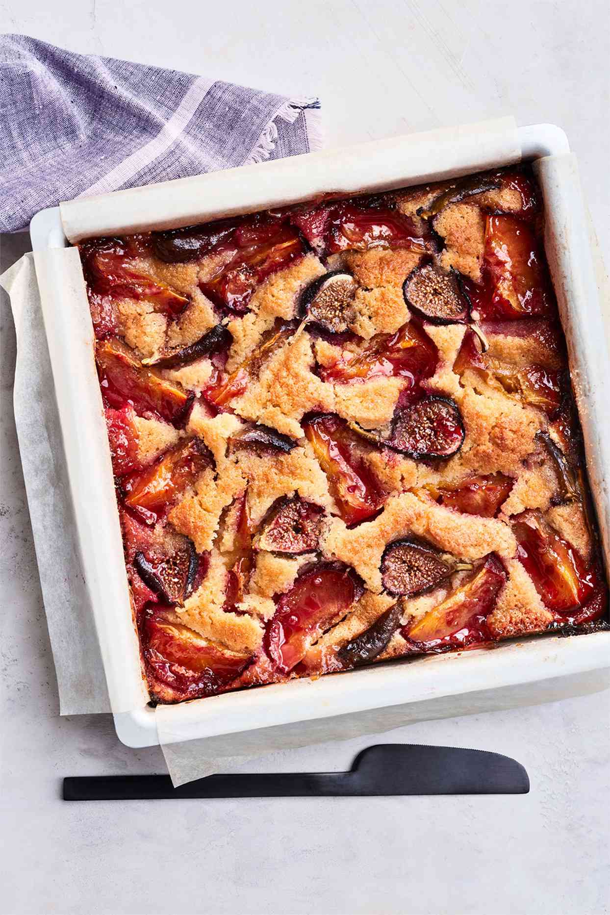 fig-and-plum cake served in a white dish