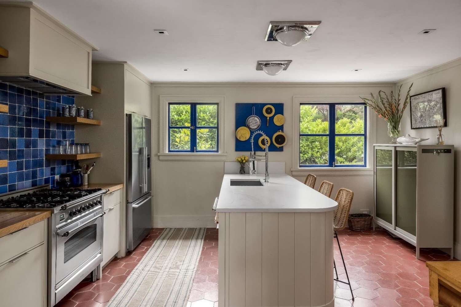 a kitchen with blue tile 