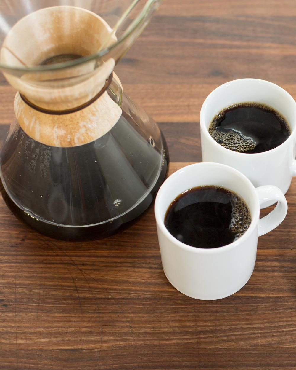 two cups of black coffee and a Chemex